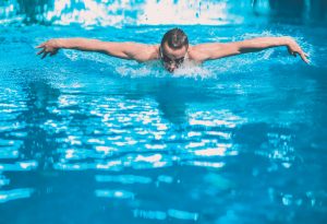 Male,Swimmer,At,The,Swimming,Pool.,Underwater,Photo.,Male,Swimmer.